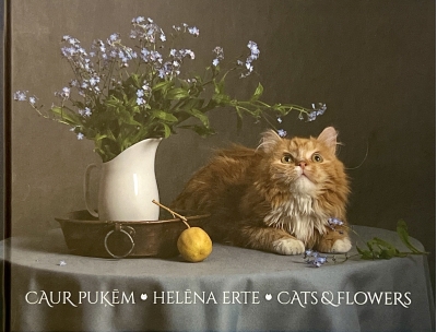 Caur puķēm. Cats and flowers